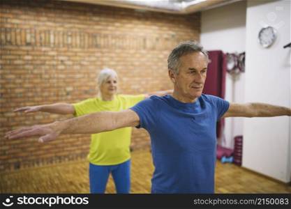 older couple training gym