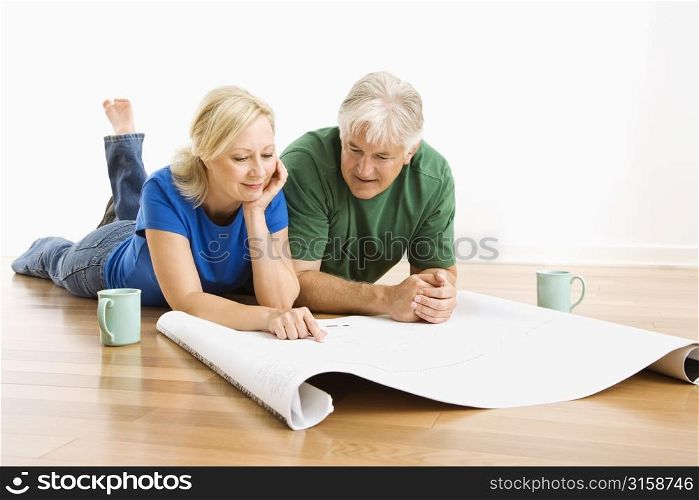 Older couple with house plans