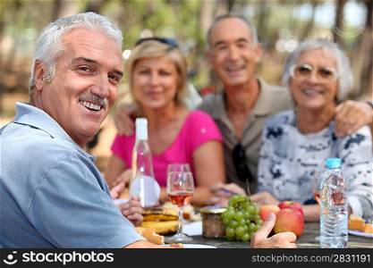 Older couples enjoying an alfresco lunch