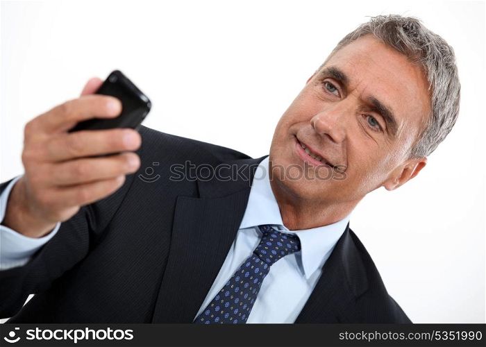 Older man checking his cellphone