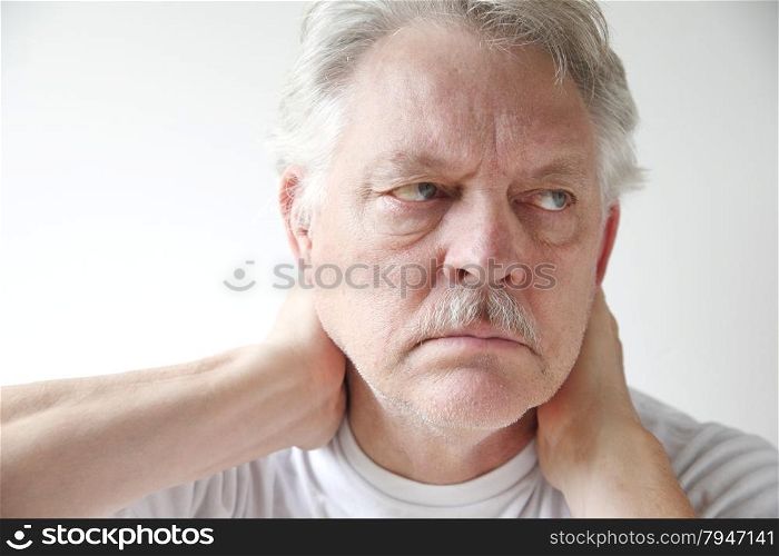 Older man experiences soreness in his neck.