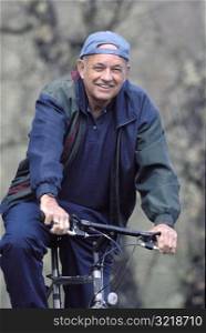 Older Man Riding a Bike