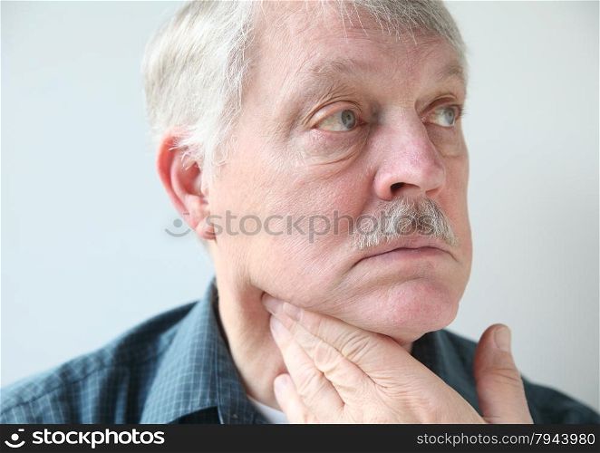 older man with a sore throat or neck