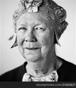 Older woman in vintage hat