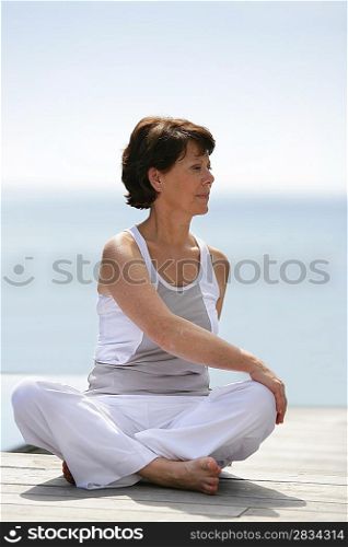 Older woman practicing yoga
