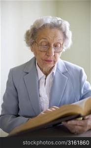 Older woman reading a book