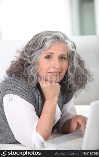 Older woman surfing the internet