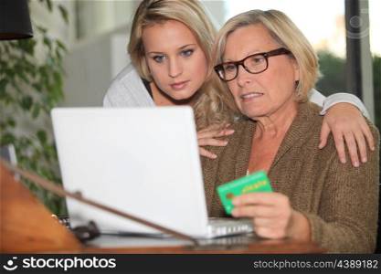 Older woman using a card online