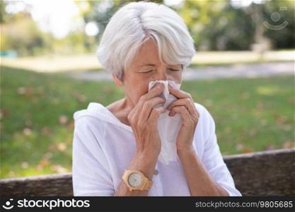 older woman with handkerchief outdoor