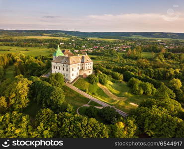 Olesko Palace from the air. Reserve. Summer park on the hills. Aerial view of the Olesky Castle, Ukraine.. Olesko Palace from the air.