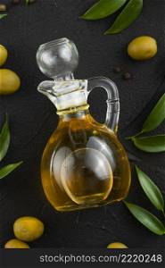 olive oil bottle table with leaves olives