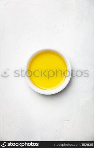 Olive oil on white stone background, flat lay