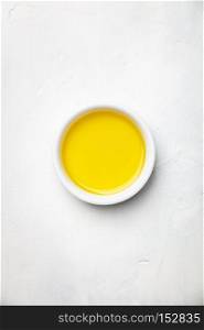 Olive oil on white stone background, flat lay