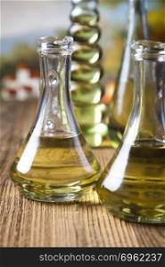 Olive oils in bottles, Mediterranean rural theme