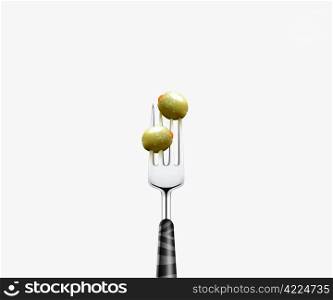 olive pierced by fork, isolated on white background