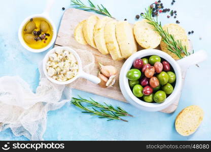 olives and fresh bread on a table