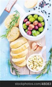 olives and fresh bread on a table