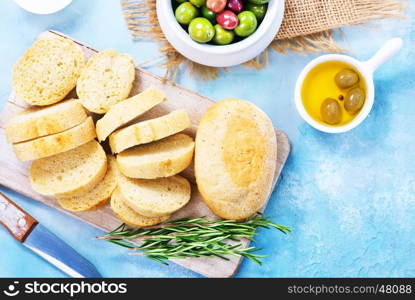 olives and fresh bread on a table