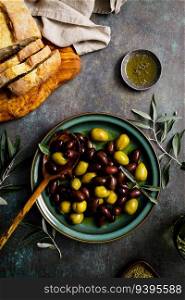 Olives and olive oil, top view