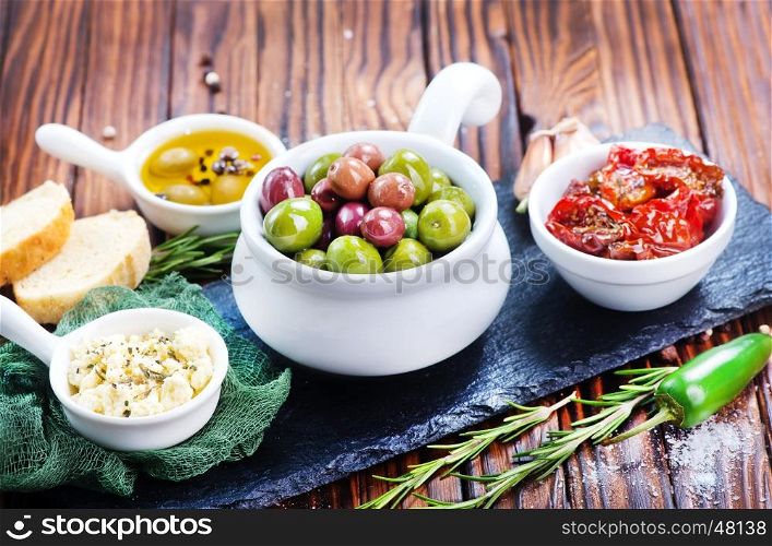 olives, cheese and dry tomato in bowl