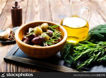 olives im bowl and oil, stock photo
