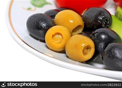 olives in a blue plate on a white background