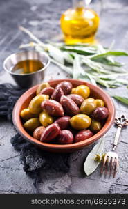 olives in bowl and on a table