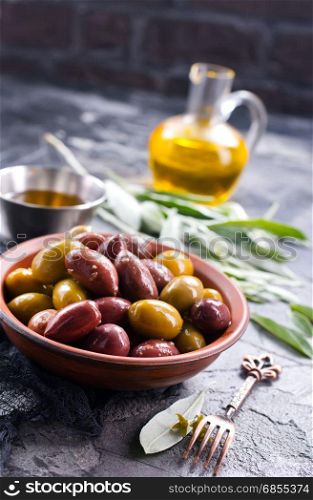 olives in bowl and on a table