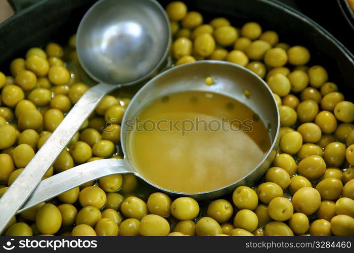 olives in pickling brine pattern background texture in market