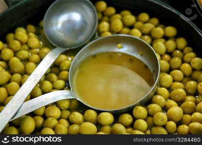 olives in pickling brine pattern background texture in market