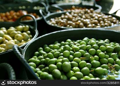 olives in pickling brine pattern background texture in market