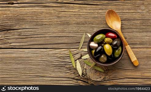 olives mix wooden spoon with copy space. High resolution photo. olives mix wooden spoon with copy space. High quality photo