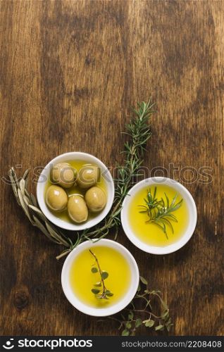 olives with olive oil rosemary bowls copy space