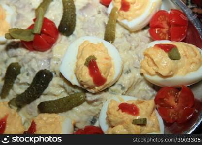 Olivier salad with stuffed eggs and pickles