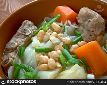 Ollada - traditional dish in Valencian.Spanish soup with pork ribs and vegetables