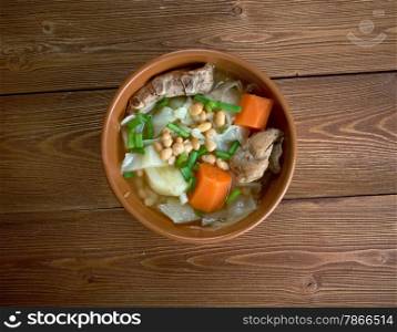 Ollada - traditional dish in Valencian.Spanish soup with pork ribs and vegetables