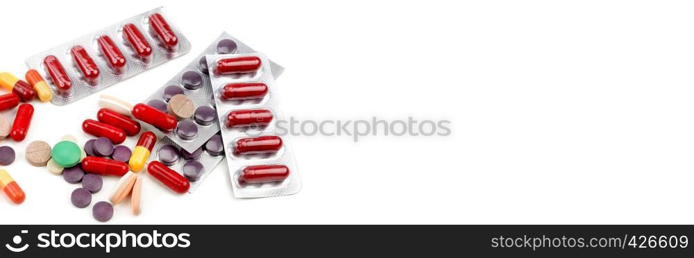 ?olorful pills on white background. Flat lay, top view. Free space for text. Wide photo .