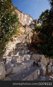 Ols stone stairs leading up to a medieval house in Rab, Croatia