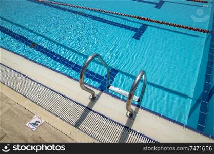 Olympic Swimming pool background on a bright Sunny day