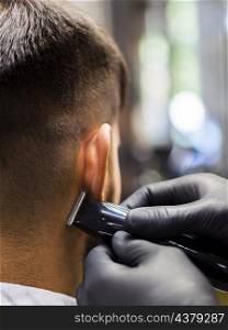OLYMPUS DIGITAL CAMERA. close up from man barber shop