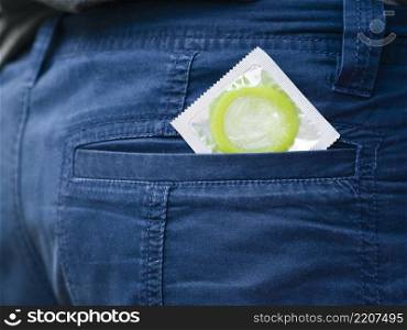 OLYMPUS DIGITAL CAMERA. close up green condom back pocket