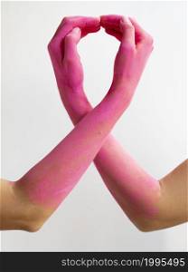 OLYMPUS DIGITAL CAMERA. close up pink painted arms expressing awareness