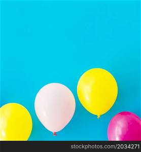 OLYMPUS DIGITAL CAMERA. colorful balloons blue background