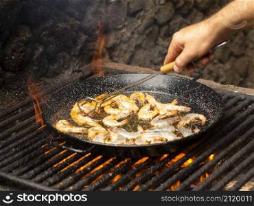 OLYMPUS DIGITAL CAMERA. cook folding shrimps frying pan