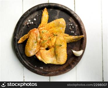 OLYMPUS DIGITAL CAMERA. cooked chicken wings with herbs