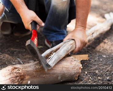OLYMPUS DIGITAL CAMERA. faceless lumberman chopping log forest