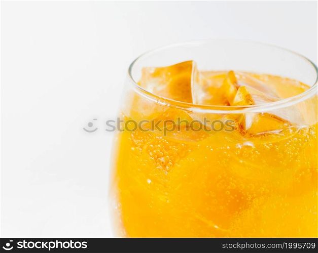 OLYMPUS DIGITAL CAMERA. full glass orange soda with ice