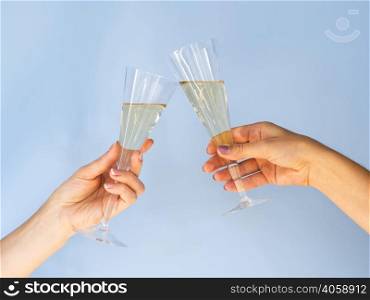 OLYMPUS DIGITAL CAMERA. glasses filled with champagne toasting