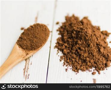 OLYMPUS DIGITAL CAMERA. heap cocoa powder table wooden spoon