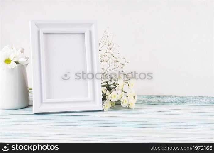 OLYMPUS DIGITAL CAMERA. High resolution photo. flowers with blank frame table. High quality photo